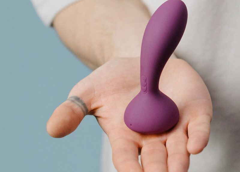 Purple Vibrator on the Person's Palm