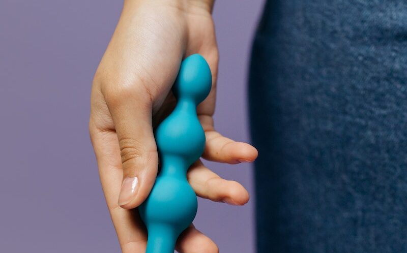 Close-Up Shot of a Person Holding an Adult Toy
