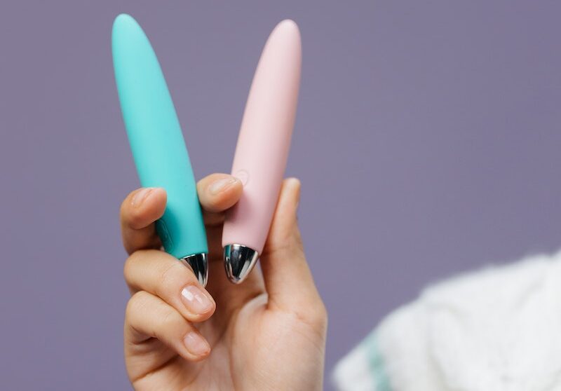Close-Up Shot of a Person Holding Adult Toys